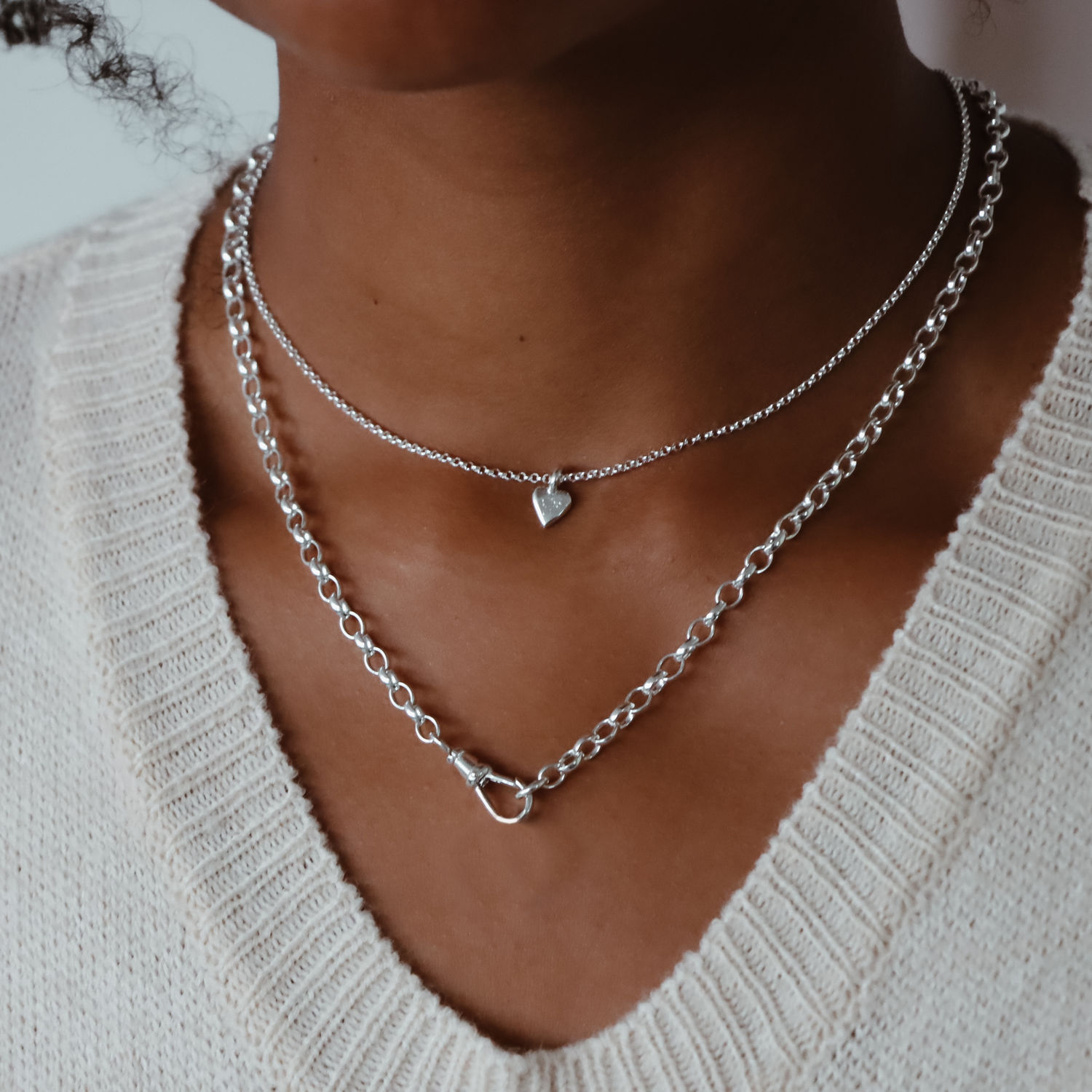 Leanne wearing a silver-colored chunky albert chain necklace with a swivel clasp, displayed against a neutral background.