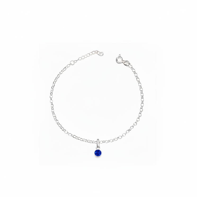 Silver bracelet with a blue gemstone on a white background