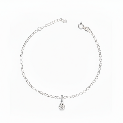 Silver bracelet with a small round pendant on a white background