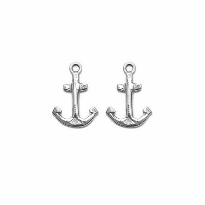  silver anchor-shaped charms on a white background
