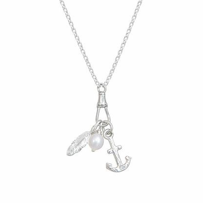 Necklace with a pendant featuring a feather, pearl, and anchor on a white background