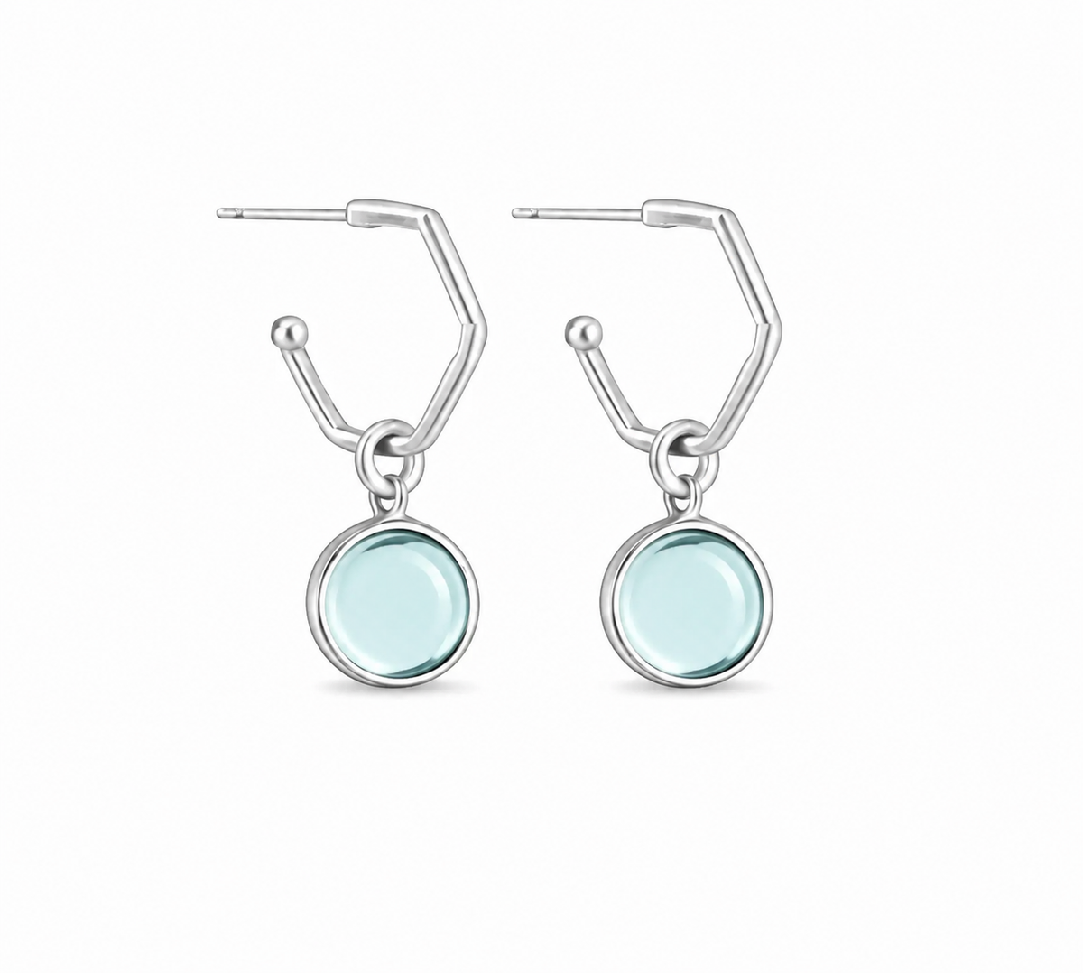 A pair of silverearrings with circular light blue aquamarine gemstones, shown on a plain white background.
