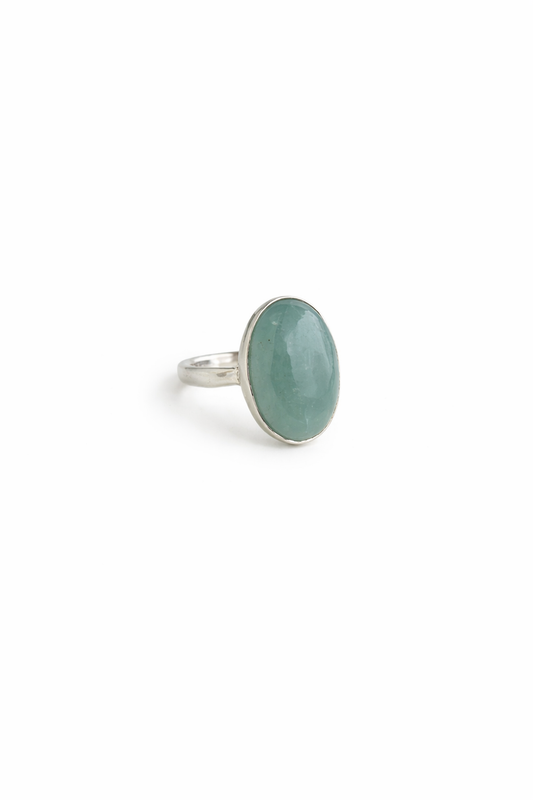 Ring with a aquamarine stone on a white background