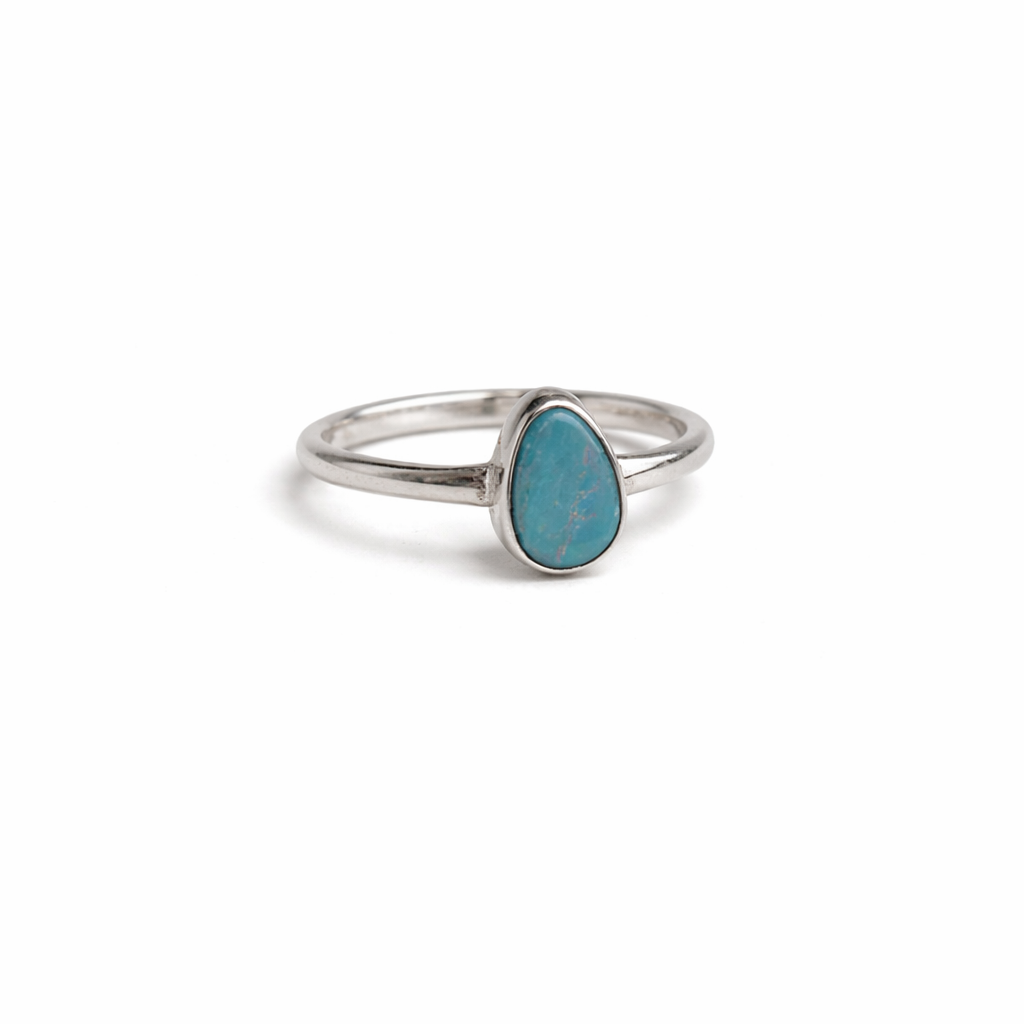Silver ring with a Australian opal stone on a white background