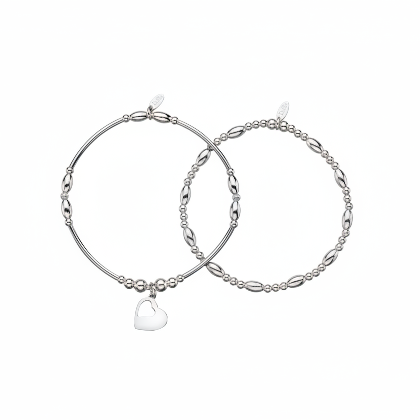 a pair of silver beaded bracelets, one with a heart, one without.