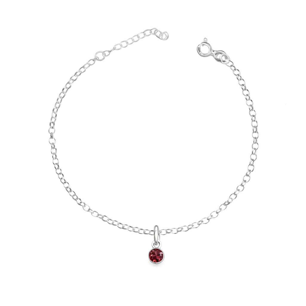 Silver bracelet with a red gemstone on a white background
