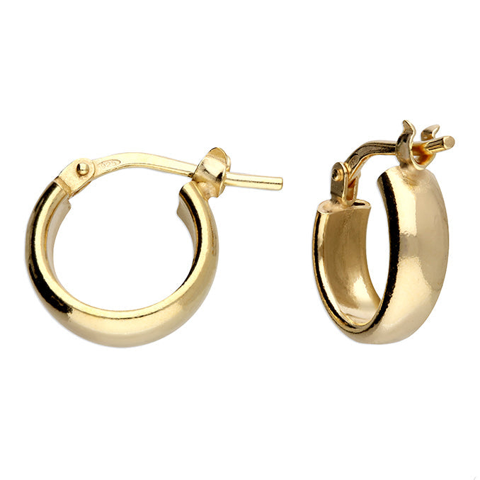 Gold hoop earrings on a white background
