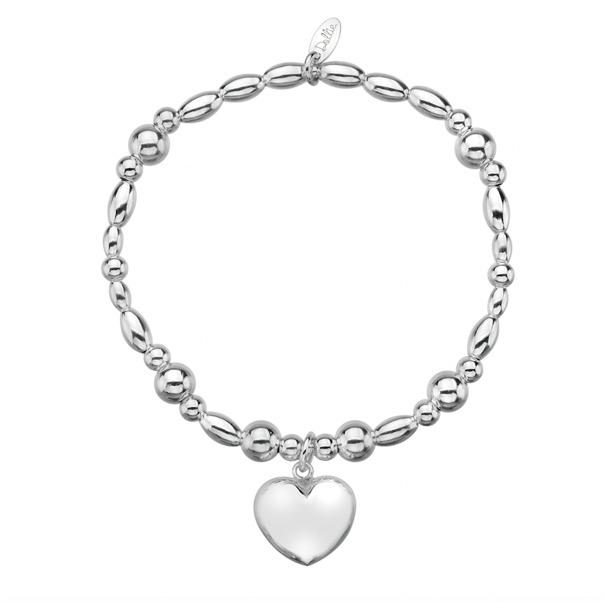 Puffed chunky heart charm on a beaded bracelet on a white background 