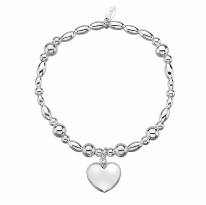 Puffed chunky heart charm on a beaded bracelet on a white background 