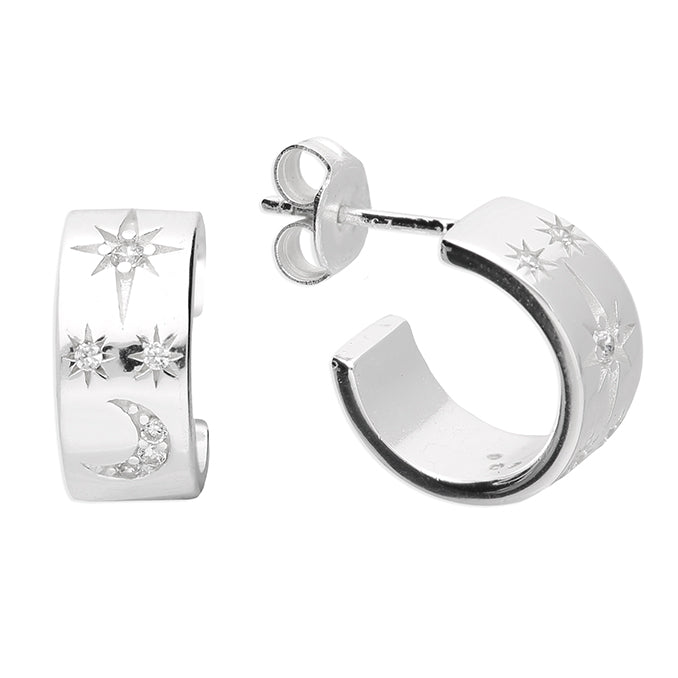 Silver hoop earrings with star and moon designs on a white background