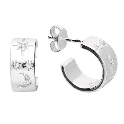 Silver hoop earrings with star and moon designs on a white background
