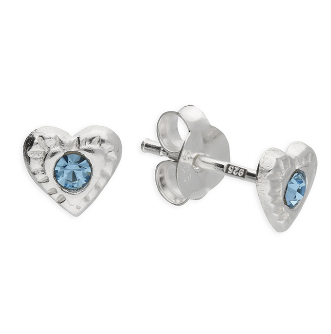 Heart-shaped silver earrings with blue gemstones on a white background