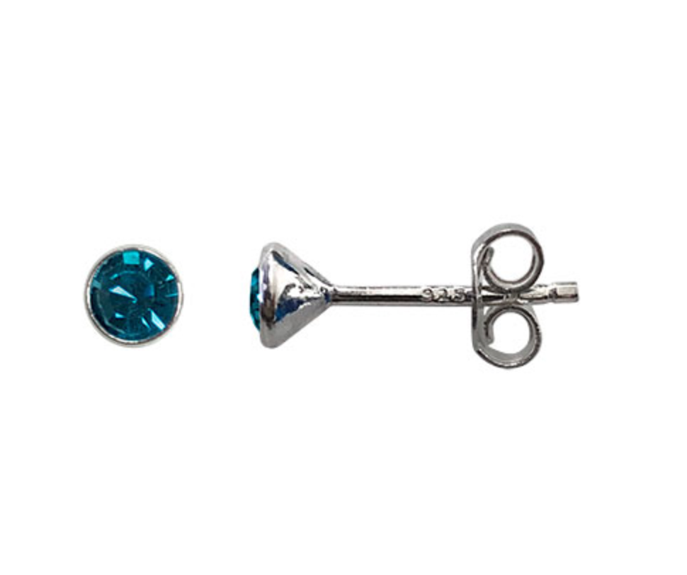 Silver earring with blue teal gemstone on a white background