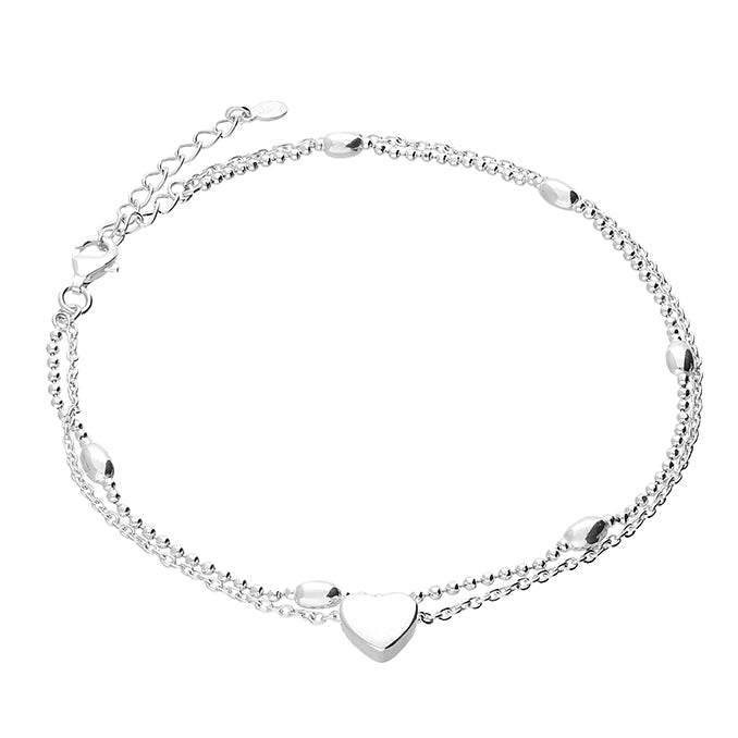 Silver anklet with a heart-shaped charm on a white background