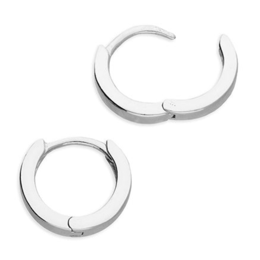 Pair of silver hoop huggie earrings on a white background