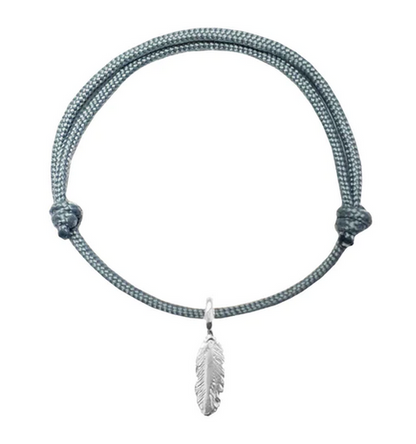 An adjustable bracelet made of rope with a silver-colored feather attached to it.
