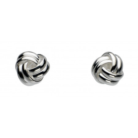 Pair of silver knot earrings on a white background
