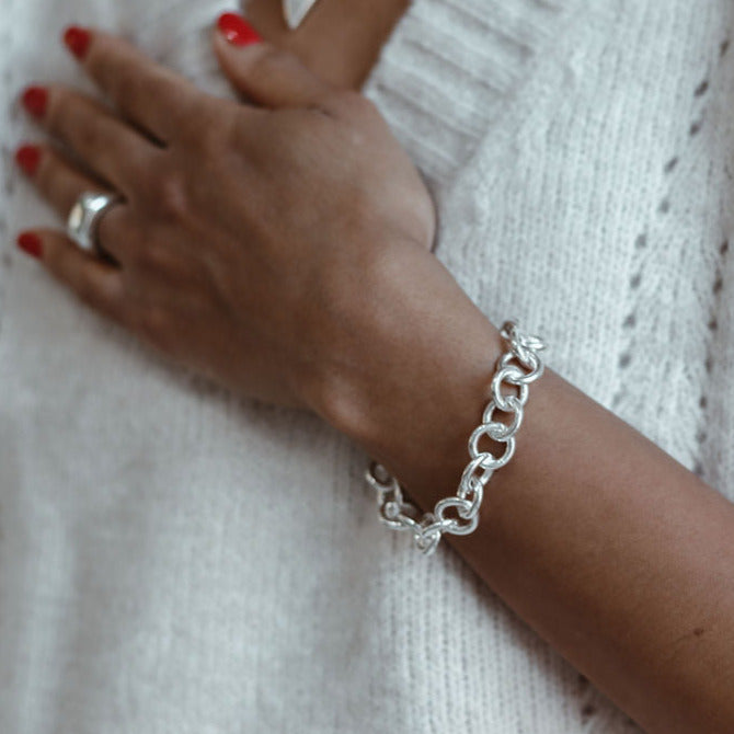 Chunky handmade sterling silver bracelet on Leanne 