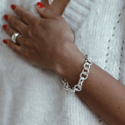 Chunky handmade sterling silver bracelet on Leanne 