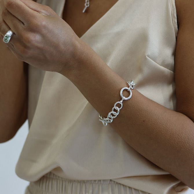 woman wrist wearing a handmade chunky silver bracelet 