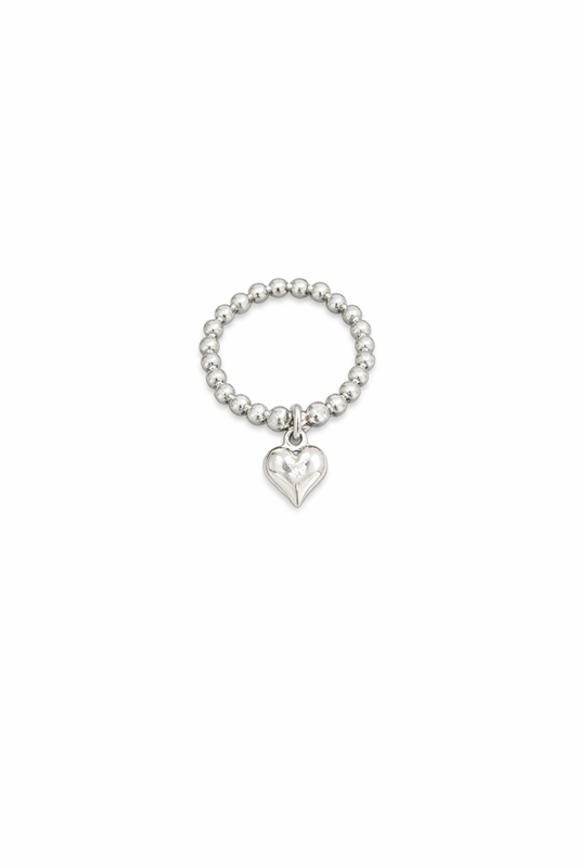 Silver beaded ring with a heart charm on a white background