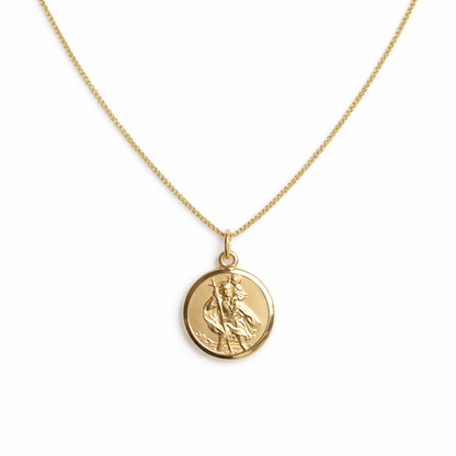 Gold plated St Christopher necklace on a white background 