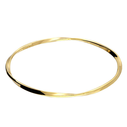 Gold bangle on a white background