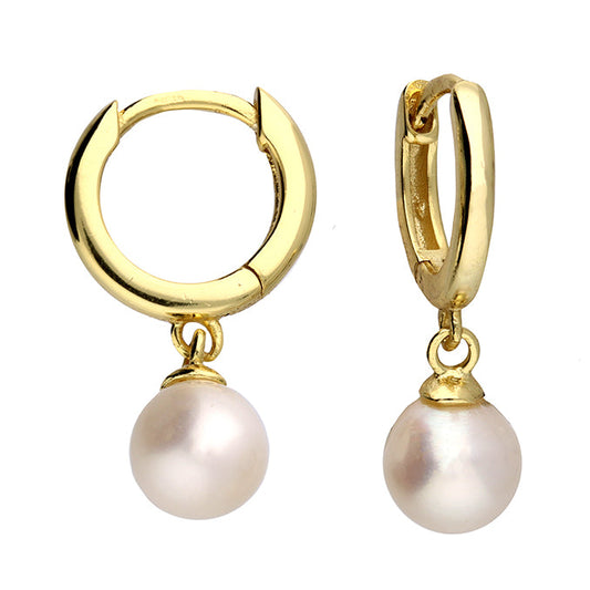 Gold hoop earrings with pearl drops on a white background