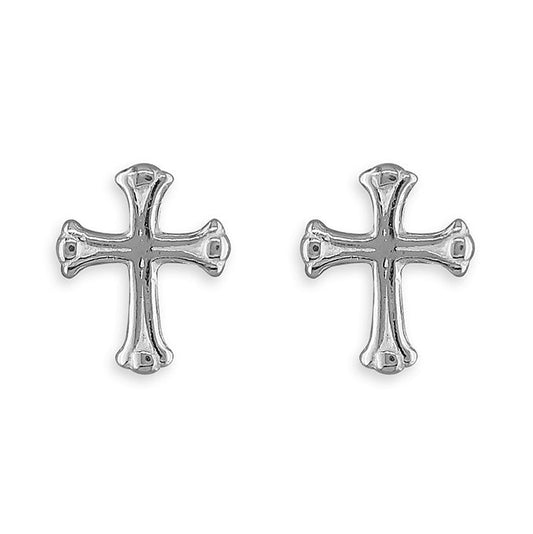 Pair of silver cross earrings on a white background