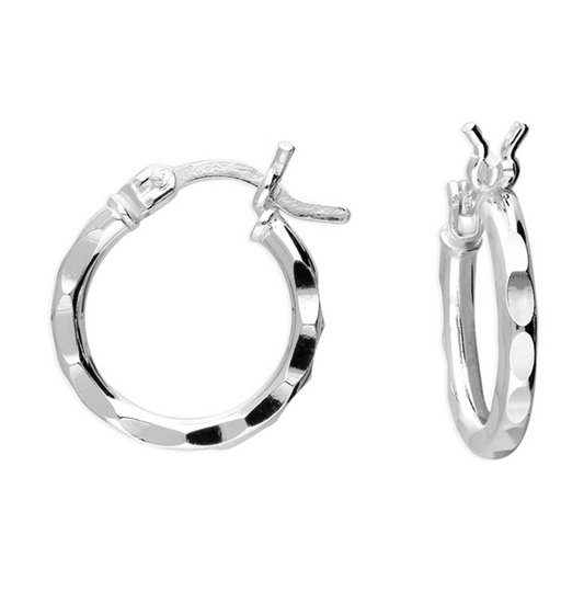 Pair of silver hammered hoop earrings on a white background