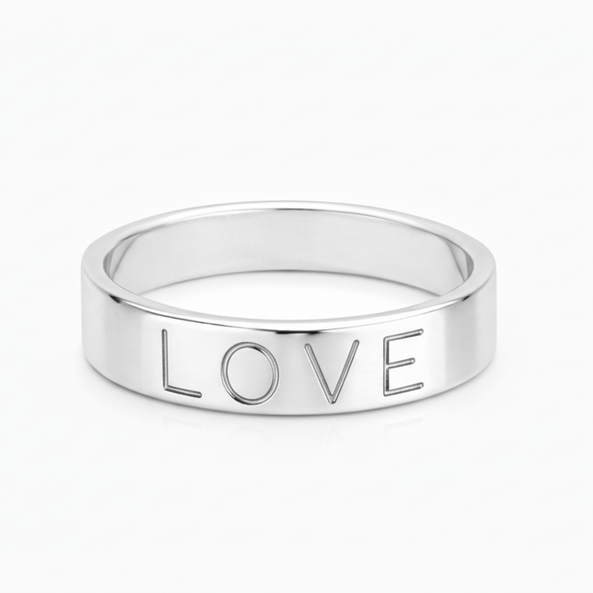 Silver ring with 'LOVE' engraving on a white background