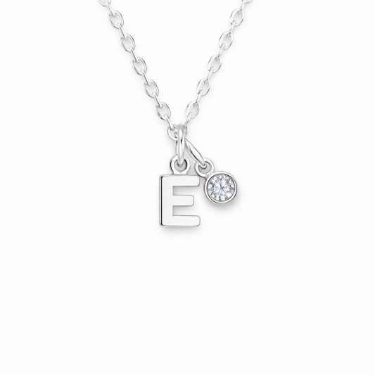 Silver necklace with letter 'E' pendant on a white background with birthstone
