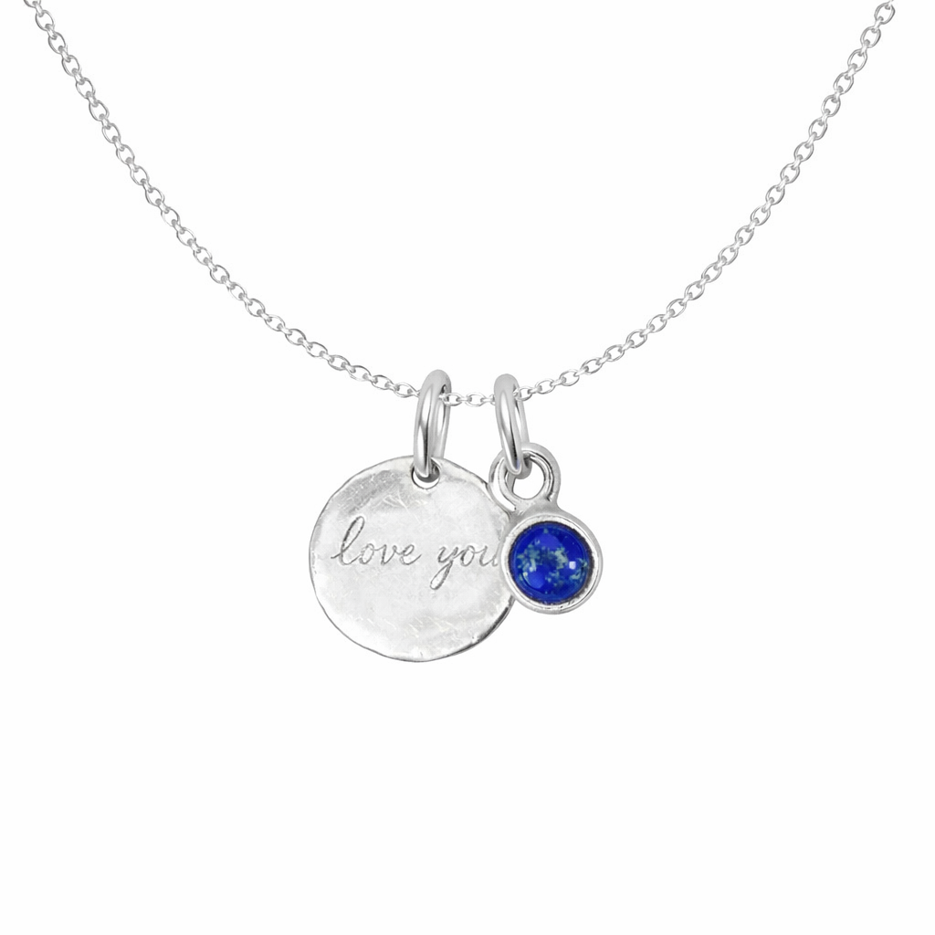 Silver necklace with 'love you' pendant and lapis  gemstone on a white background