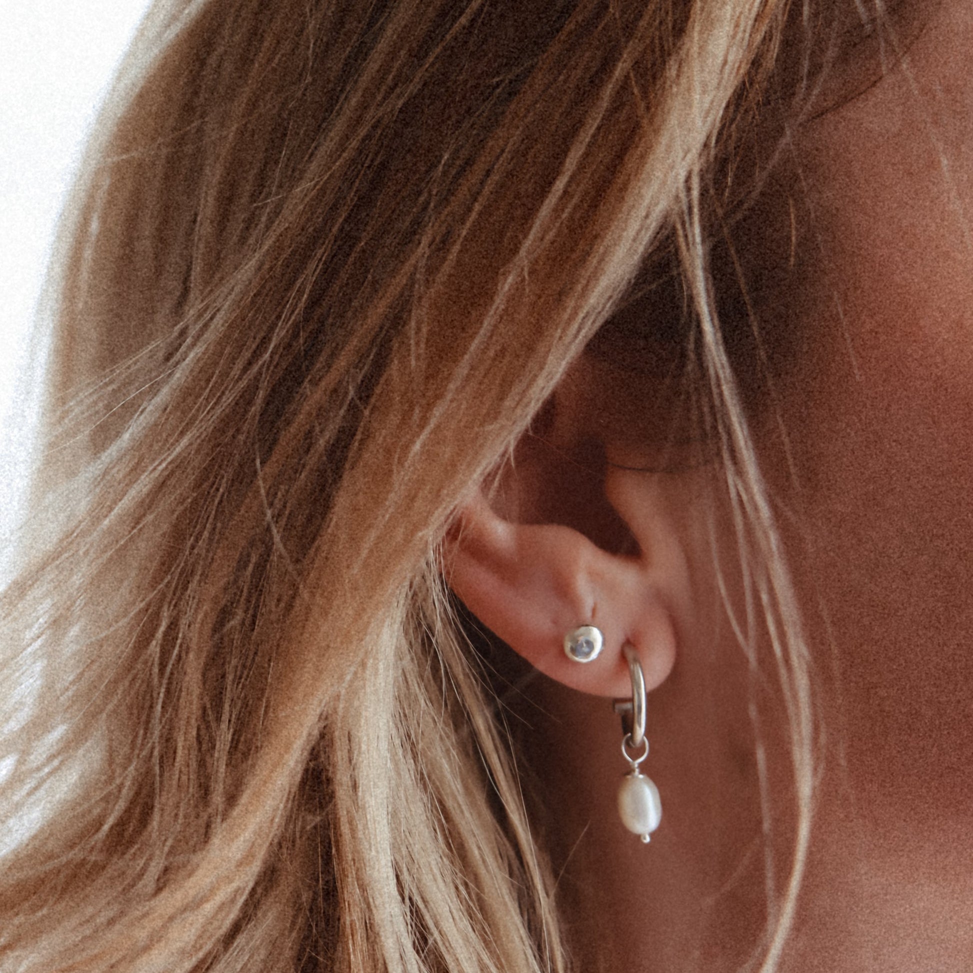 Katie wearing silver lava studs 