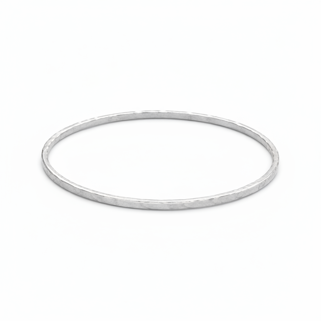 Silver bangle on a white background