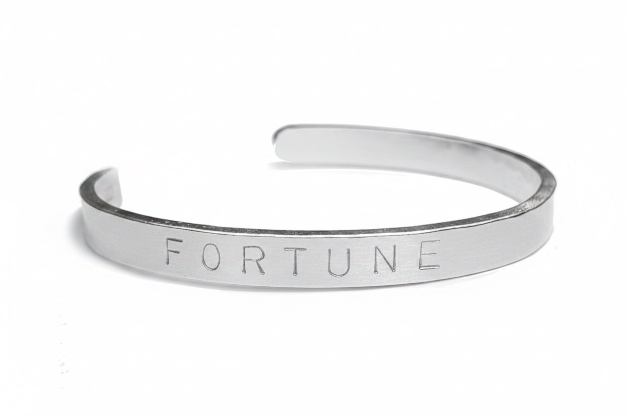 Maxi personalised cuff bangle displayed on a white background 
