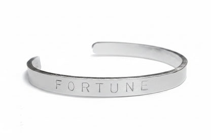 Maxi personalised cuff bangle displayed on a white background 