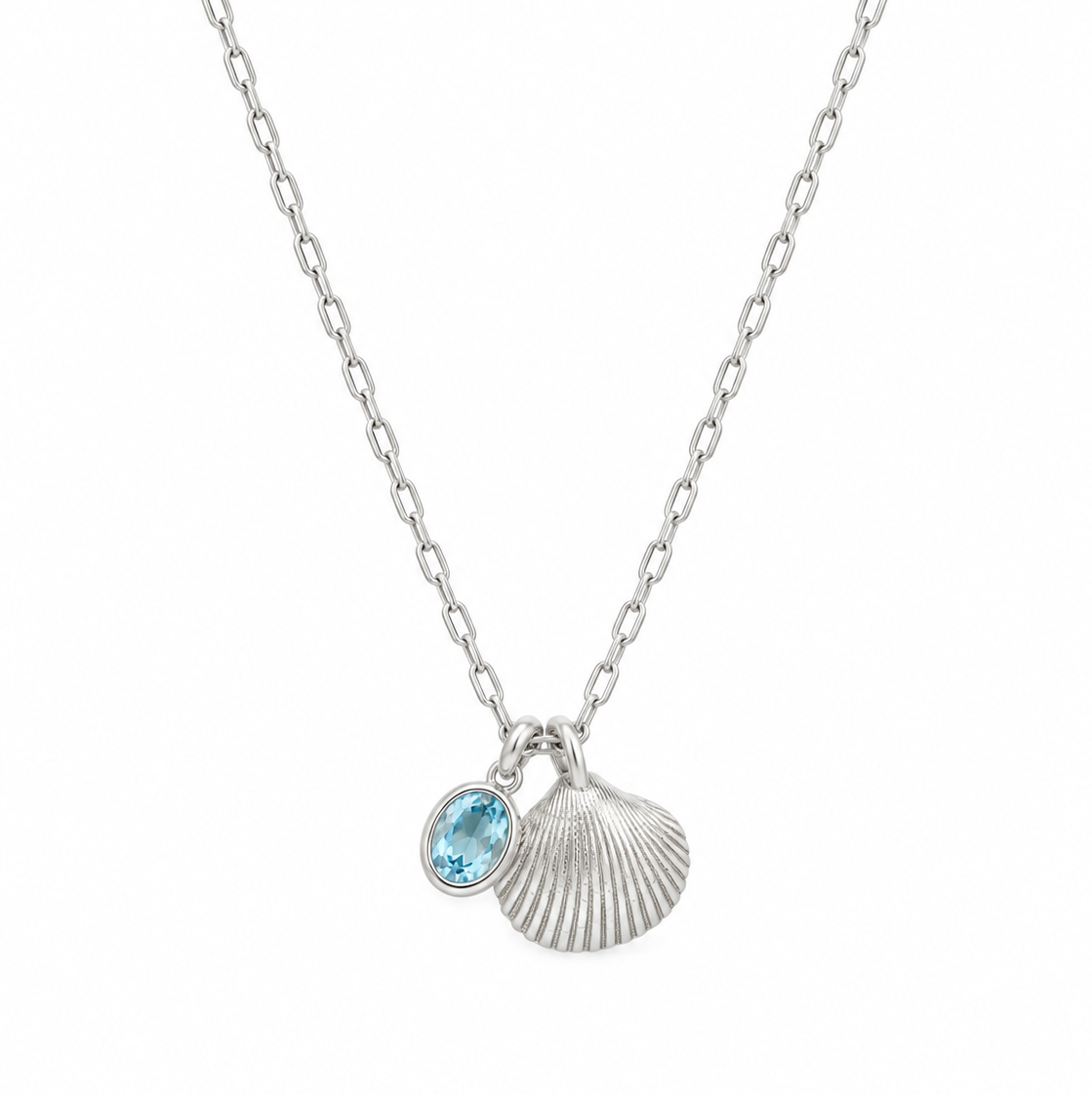 Maxi shell on a teeny trace necklace with a blue topaz gemstone