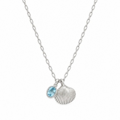 Maxi shell on a teeny trace necklace with a blue topaz gemstone