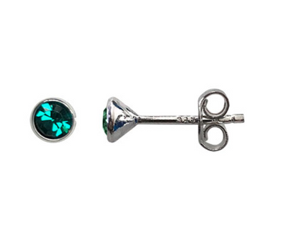 Silver earring with green gemstone on a white background
