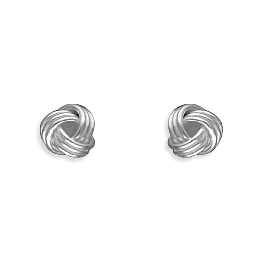 Pair of silver knot earrings on a white background
