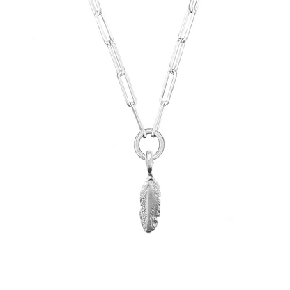 A sterling silver necklace with a trace chain link and a feather-shaped pendant.