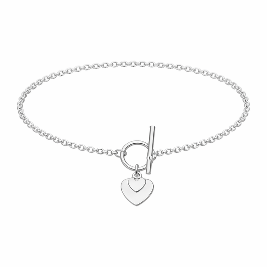 Silver bracelet with a heart-shaped charm on a white background