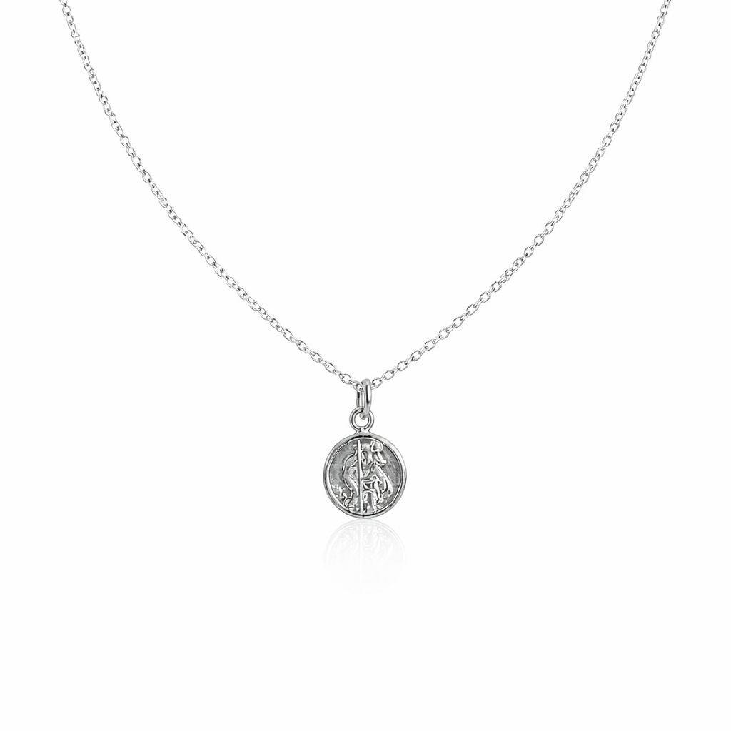 Silver necklace with a round st Christopher pendant on a white background