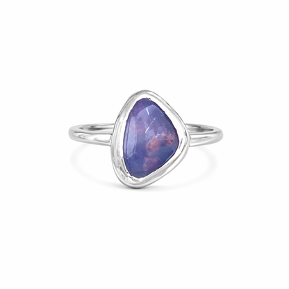 Silver ring with a austrialian opal stone on a white background