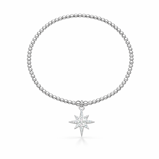 Silver bracelet with a North Star pendant on a white background
