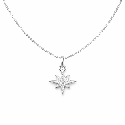 North Star diamond pendant on a chain against a white background