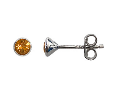silver stud with citrine gemstone on white background 