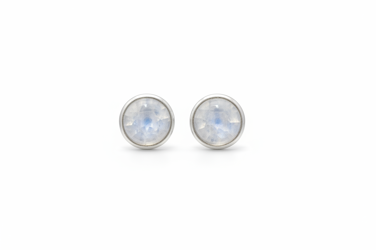 Pair of silver stud earrings with rainbow moonstone stones on a white background