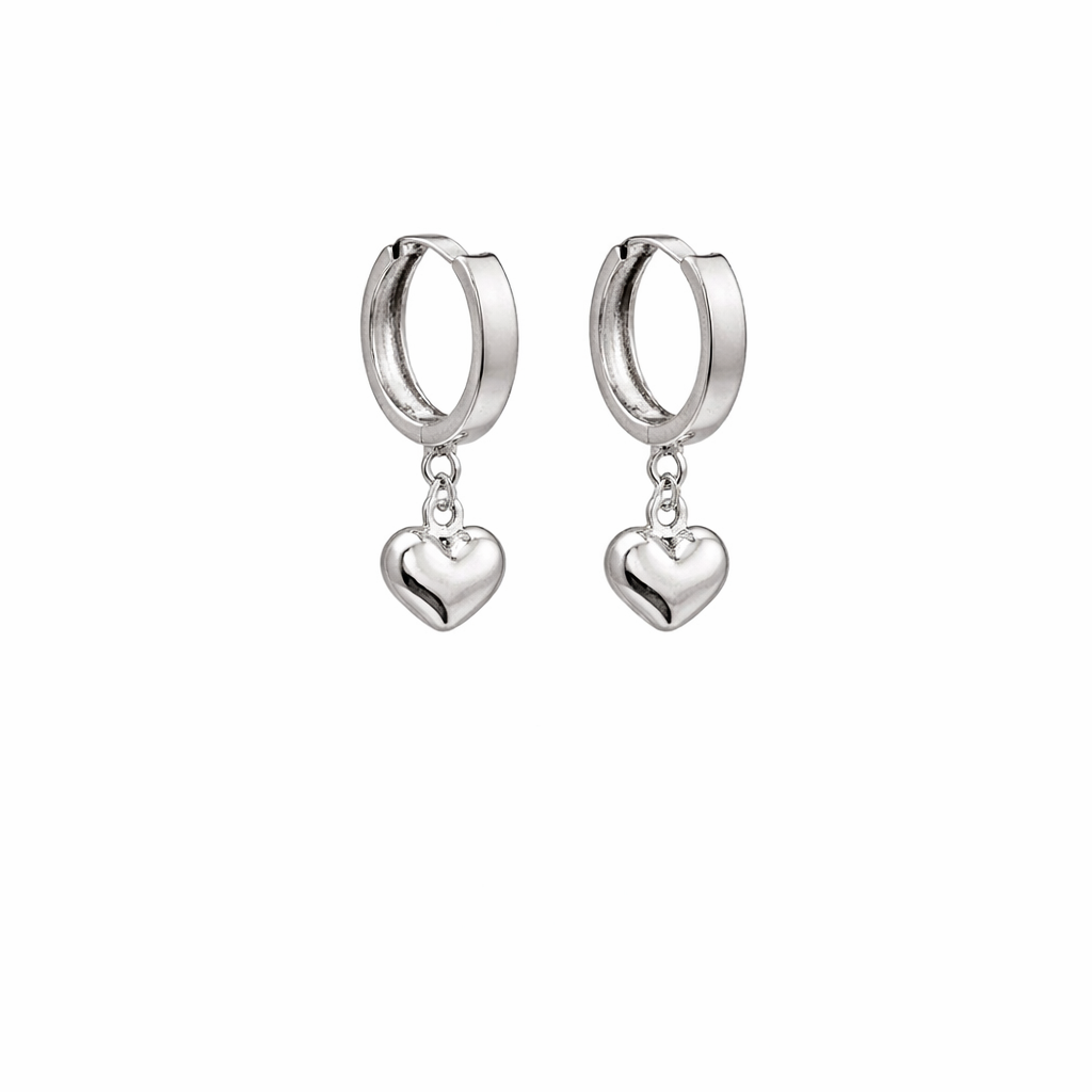 Silver hoop earrings with heart pendants on a white background